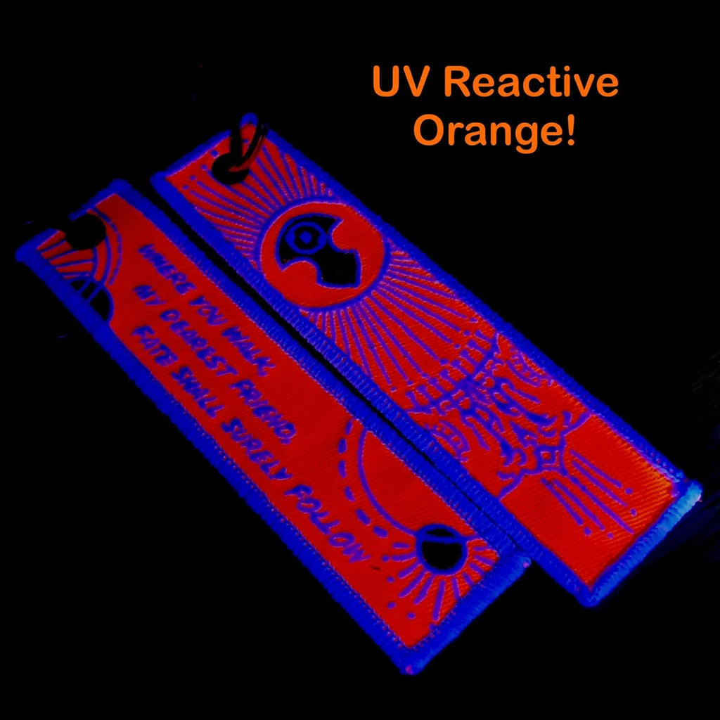 UV reactive orange tags on a black background.